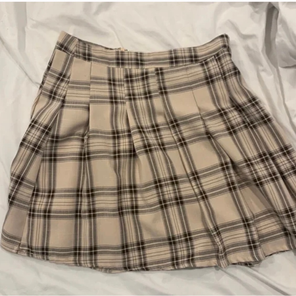 This is a black and white plaid mini skirt it fits well if your a xs